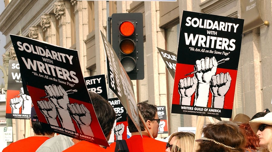 This November 20, 2007 photo shows demonstrators holding signs during the 2007–2008 Writers Guild of America strike in Hollywood. Thousands of Hollywood television and movie writers will go on strike May 2, 2023, their union said, after talks with studios and streamers over pay and other conditions ended without a deal. Credit: AFP Photo