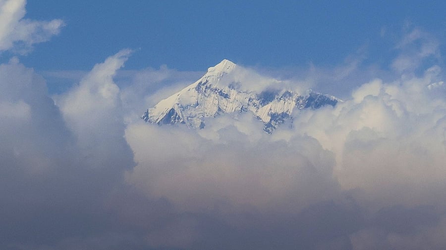 An aerial picture taken midair from an helicopter shows the summit of Mount Everest, the highest mountain in the world at 8,848 metres, in Nepal's Himalayas range. Credit: AFP Photo