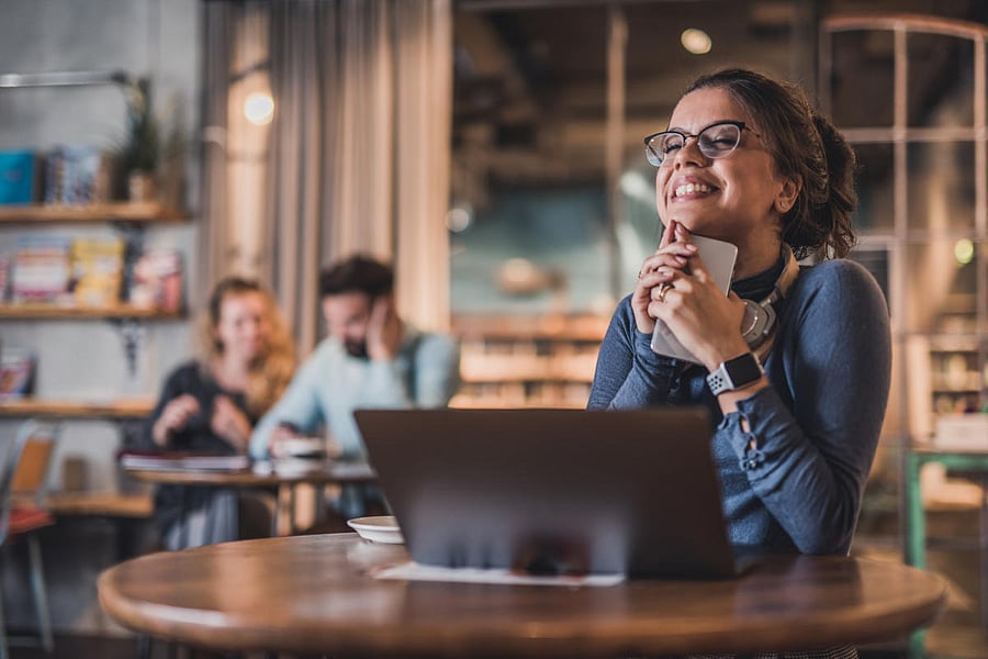 Happy and young female student.