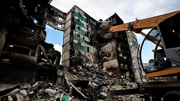 A rescuer walks during a search operation for bodies under the rubble of a building destroyed by Russian shelling, amid Russia's Invasion of Ukraine, in Borodianka, Kyiv region, Ukraine, in 2022. Credit: Reuters File Photo