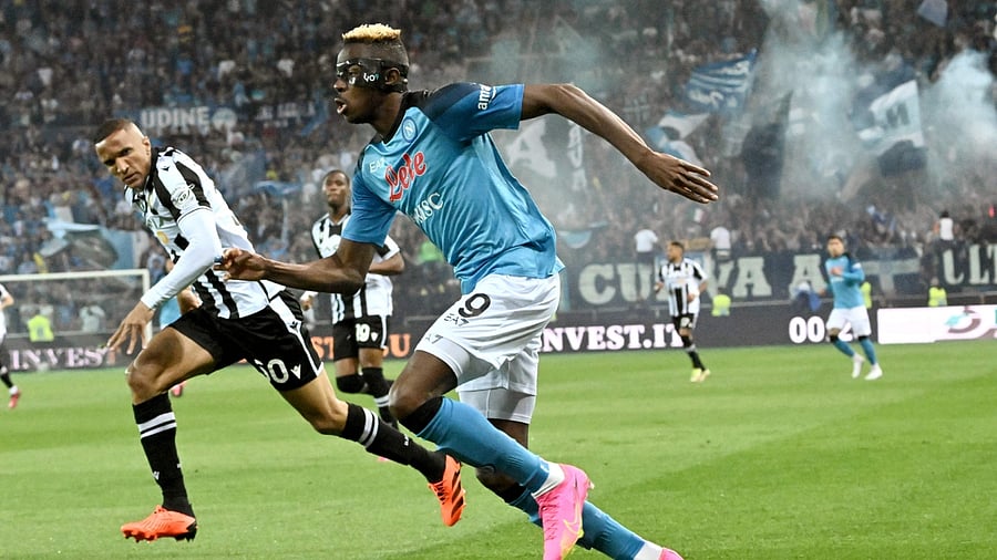 Napoli's Victor Osimhen (R) challenges Udinese's Brazilian defender Rodrigo Becao (L). Credit: AFP Photo