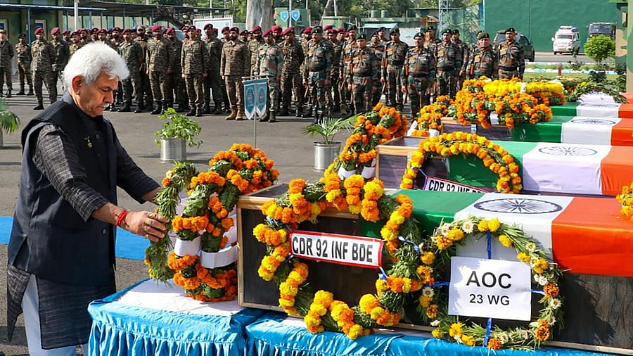 J&K Lt. Governor Manoj Sinha pays homage to five soldiers killed in an IED explosion during an encounter with terrorists in Rajouri, in Jammu. Credit: PTI Photo