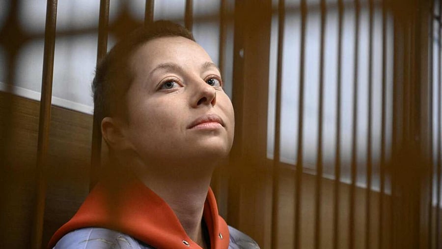Russian theater director Yevgeniya Berkovich, detained on charges of justification of terrorism over her award-winning play about Russian Islamic State brides, sits inside a defendants' cage during her remand hearing at the Zamoskvoretsky district court in Moscow on May 5, 2023.  Credit: AFP Photo