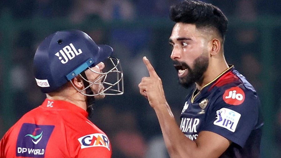 A heated moment between Warner and Siraj in the match. Credit: IANS Photo