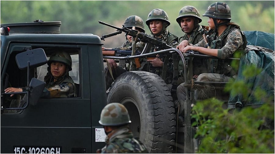 Indian Army servicemen patrol a violence-hit area in Manipur. Credit: AFP Photo