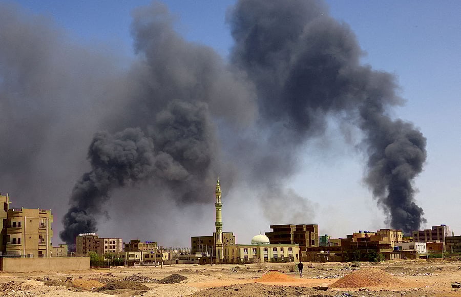 smoke rises above buildings after aerial bombardment in Khartoum North. Credit: Reuters Photo