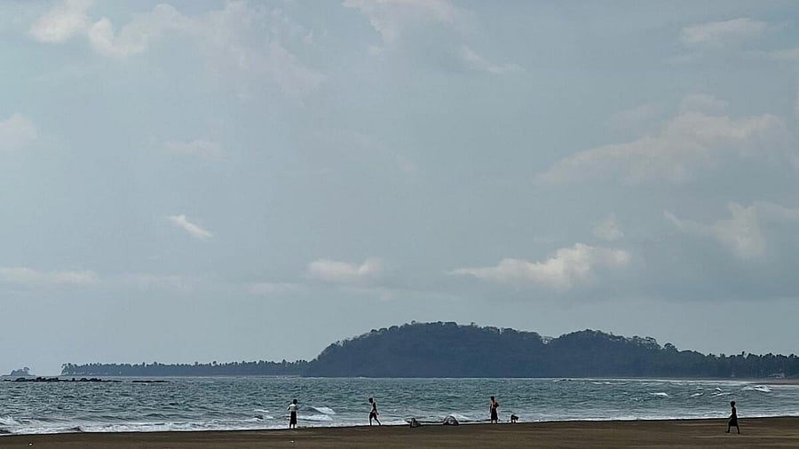 People walk on Kan Thar Yar beach near Gwa township, on May 11, 2023 after Cyclone Mocha, the Bay of Bengal's first cyclone of the year formed. Credit: AFP Photo