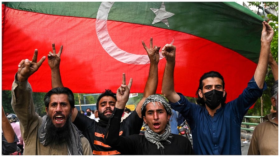 Pakistan Tehreek-e-Insaf (PTI) party activists and supporters of Pakistan's former Prime Minister Imran Khan celebrate after Supreme Court declared Khan's arrest "invalid", in Lahore on May 11. Credit: AFP Photo