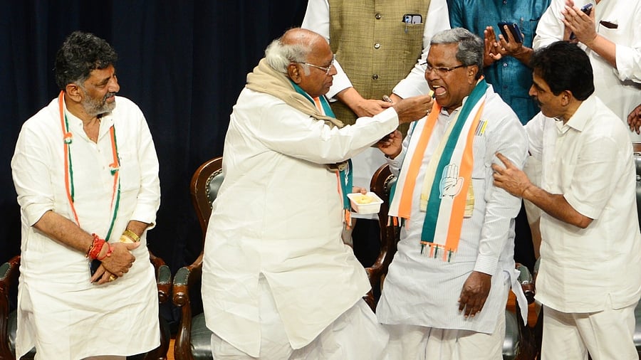 Congress President Mallikarjun Kharge with senior party leaders Siddaramaiah, D.K. Shivakumar and K.C. Venugopal during celebrations after the party's win in Karnataka Assembly elections. Credit: PTI Photo