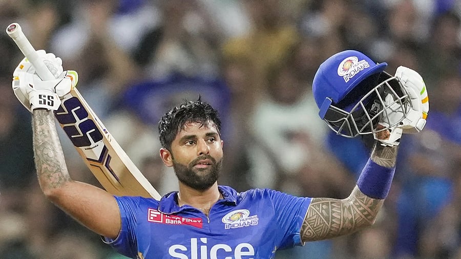 Mumbai Indians batter Suryakumar Yadav celebrates his century. Credit: PTI Photo