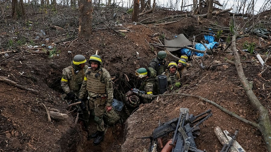 Ukrainian servicemen look on after a fight, as Russia's attack on Ukraine continues, near the front line city of Bakhmut, in Donetsk region, Ukraine May 11, 2023. Credit: Reuters Photo