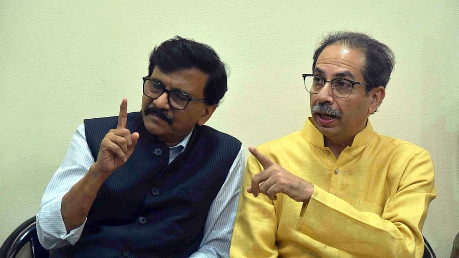 Shiv Sena (UBT) chief Uddhav Thackeray with party leader Sanjay Raut. Credit: PTI Photo
