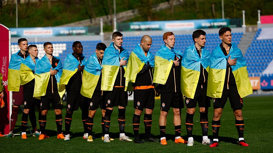 Shakhtar Donetsk players line up wearing Ukrainian flags before the Ukrainian Premier League match against Dynamo Kyiv, in Kyiv, Ukraine, April 22, 2023. Credit: Reuters Photo