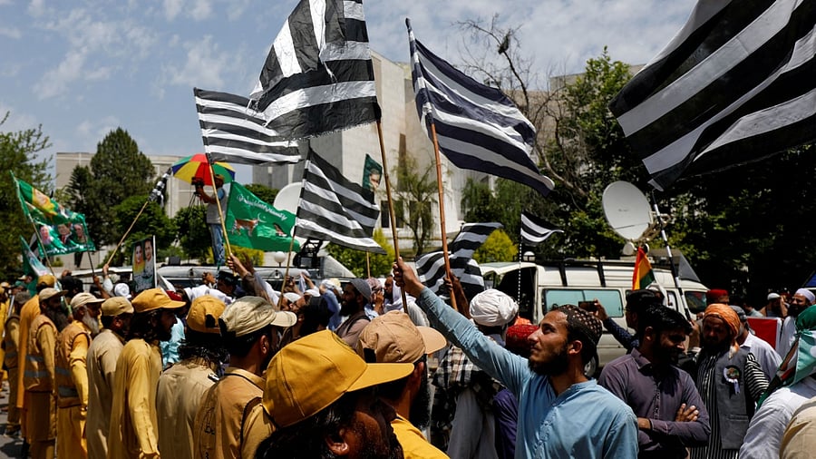 Supporters of Pakistan Democratic Movement (PDM), a coalition of political parties, gather outside the Supreme Court of Pakistan to protest against the granting of bail in several cases to Pakistan's former Prime Minister Imran Khan, in Islamabad, Pakistan May 15, 2023. Credit: Reuters Photo