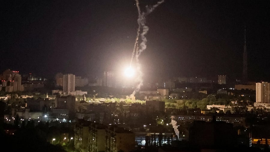 Explosion of a missile is seen in the sky over the city during a Russian missile strike, amid Russia's attack on Ukraine, in Kyiv. Credit: Reuters Photo