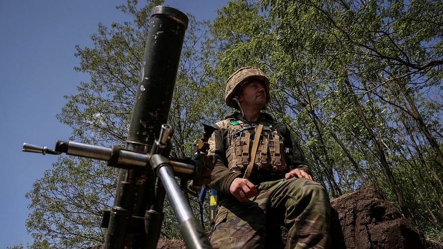 A Ukrainian service member prepares to fire a mortar at a front line near the city of Bakhmut. Credit: Reuters Photo