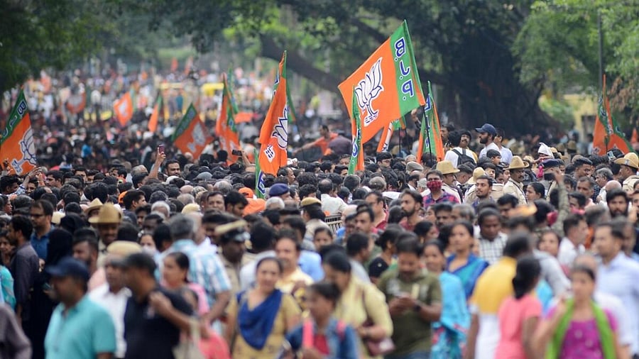BJP supporters during Prime Minister Narendra Modi's roadshow ahead of Karnataka Assembly elections, in Bengaluru, Saturday, May 6, 2023. Credit: IANS Photo