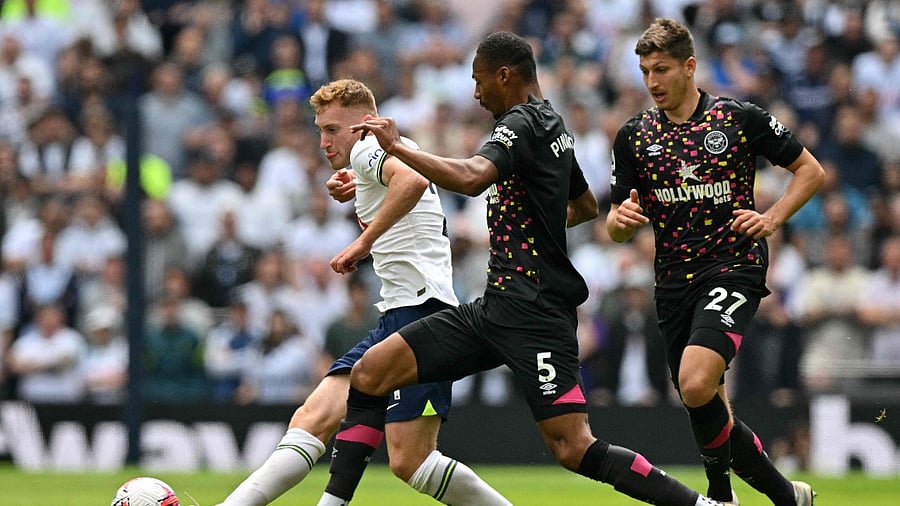 Brentford's German midfielder Vitaly Janelt (R) and Brentford's English-born Jamaican defender Ethan Pinnock (C) vie with Tottenham Hotspur's Swedish midfielder Dejan Kulusevski. Credit: AFP Photo