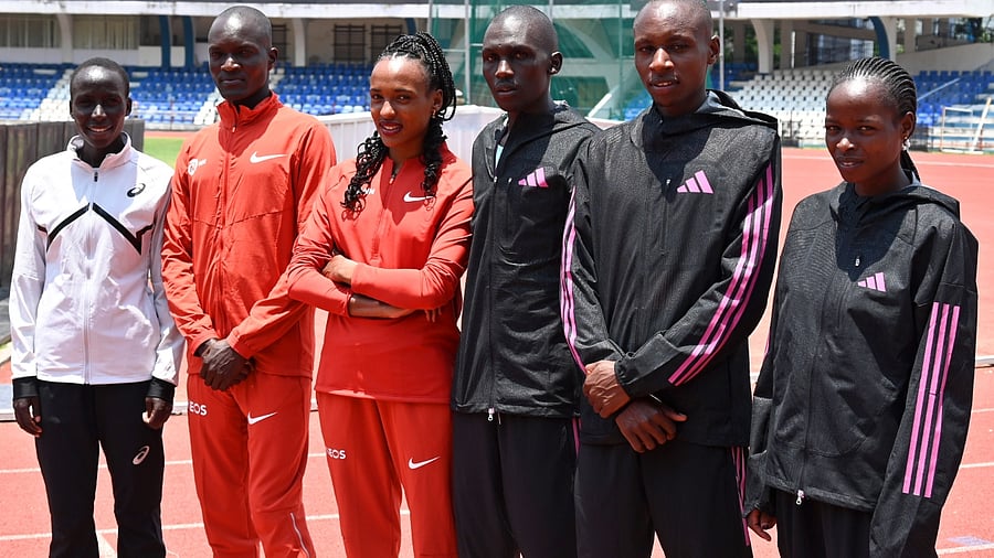 International elite men and women runners (L-R) Victory Chepnngeno (Kenya), Stephen Kissa (Uganda), Tsehay Gemechu (Ethiopia), Nicholas Kipkorir Kimeli (Kenya), Sebastain Sawe (Kenya), Jesca Chelangat (Kenya) pose during a photo session ahead of TCS World 10k run at Sree Kanteerava Stadium, Bengaluru. Credit: DH Photo/Pushkar V