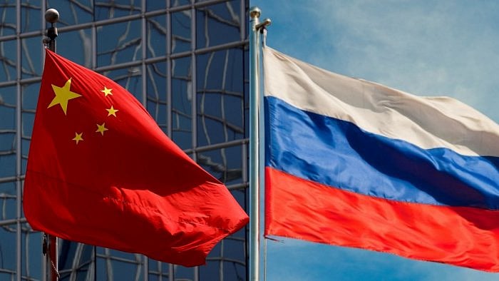 The flags of the People's Republic of China and the Russian Federation. Credit: Reuters/iStock Photo