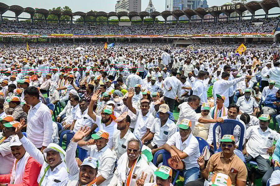 A sea of supporters descend on Kanteerava Stadium to witness the oath-taking ceremony of the Congress government, in Bengaluru on Saturday. Credit: DH Photo/M S Manjunath