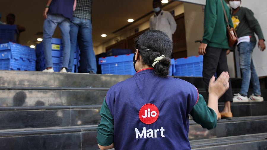 A woman wearing a Reliance JioMart vest. Credit: Reuters Photo