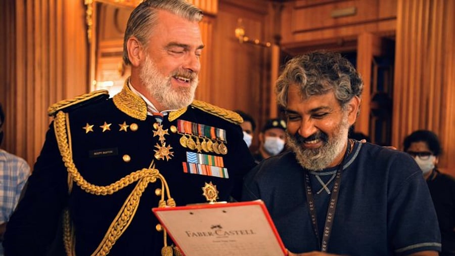Director SS Rajamouli with actor Ray Stevenson on the sets of 'RRR'. Credit: Twitter/@ssrajamouli