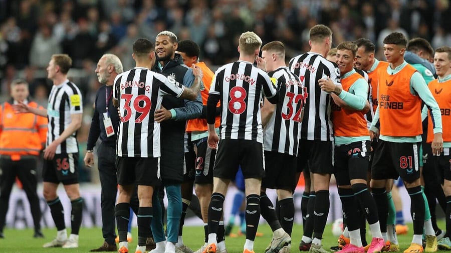 Newcastle United's Joelinton and Bruno Guimaraes celebrate after qualifying for the Champions League. Credit: AFP Photo