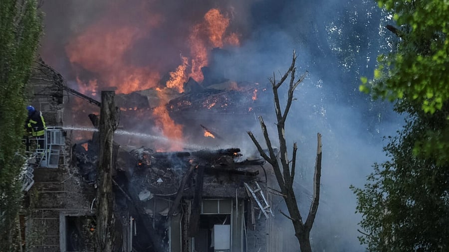 A rescuer works at a site of a clinic heavily destroyed by a Russian missile strike in Dnipro, Ukraine. Credit: Reuters Photo