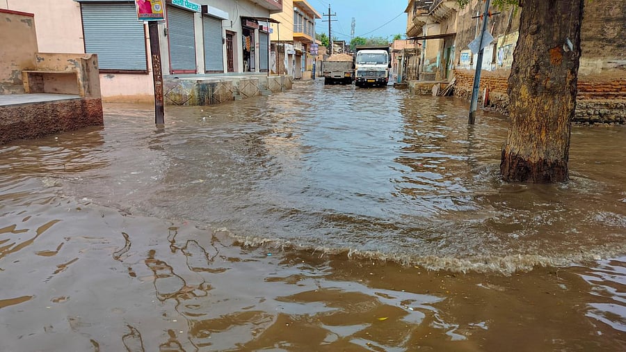 A waterlogged area due to rain during the scorching heat. Credit: PTI Photo