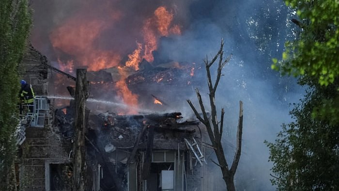 A rescuer works at a site of a clinic heavily destroyed by a Russian missile strike in Dnipro, Ukraine. Credit: Reuters Photo