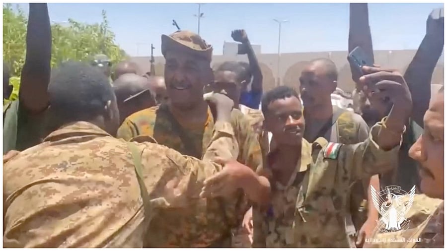 Sudan's military leader General Abdel Fattah al-Burhan meets soldiers at the Army headquarters, in Khartoum, Sudan, in this screengrab obtained from a handout video released on May 17, 2023. Credit: Reuters Photo
