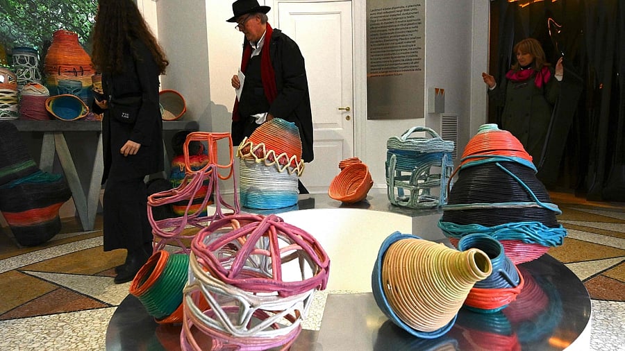 Visitors view the installation 'Everlasting Plastics' recycled petrochemical polymers. Credit: AFP File Photo