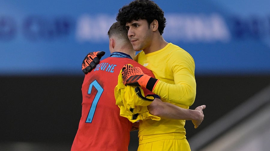England's midfielder Alfie Devine (L) greets Iraq's goalkeeper Hasan Hussein at the end of the Argentina 2023 U-20 World Cup Group E football match between Iraq and England at the Estadio Unico Diego Armando Maradona stadium in La Plata. Credit: AFP Photo