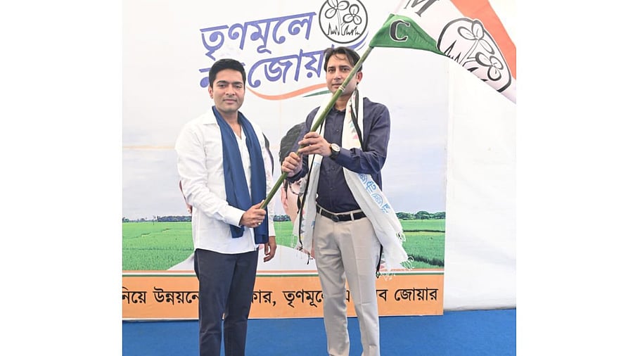 Bayron Biswas with TMC leader Abhishek Banerjee. Credit: Twitter/ @AITCofficial