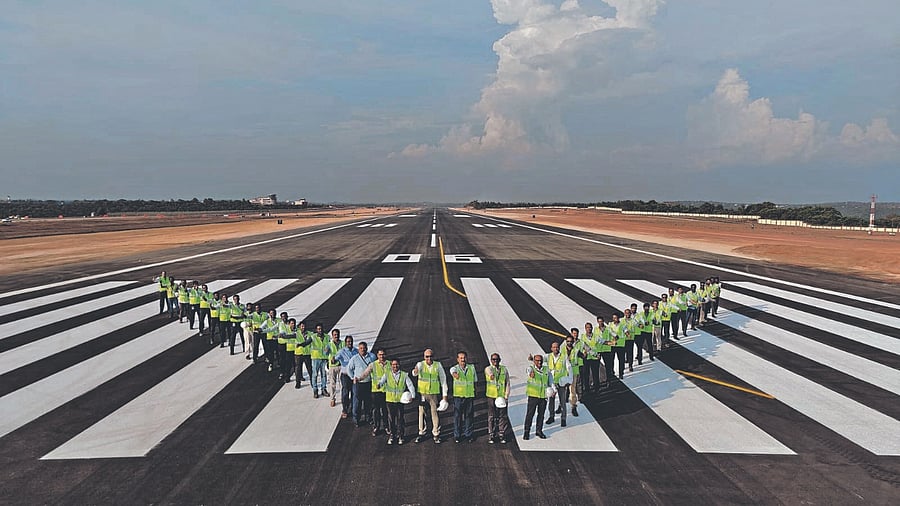 Mangaluru International Airport teams sign off with a V to mark end of runway recarpeting work. Credit: Special Arrangement