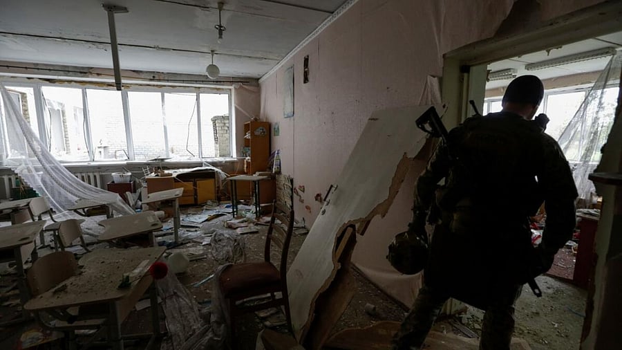 A Ukrainian serviceman inspects a damaged school building, amid Russia's attack on Ukraine, in the village near a frontline in Donetsk region, Ukraine June 1, 2023. Credit: Reuters Photo