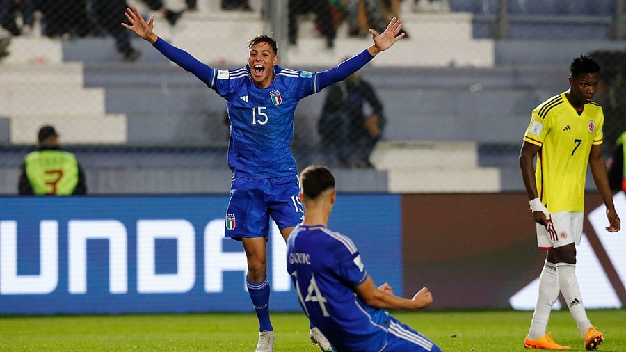  Italy's Gabriele Guarino celebrates with Alessandro Fontanarosa after the match. Credit: Reuters Photo