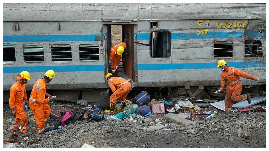 NDRF personnel during the restoration work at the site of Friday's triple train accident near Bahanaga Bazar railway station, in Balasore district. Credit; PTI Photo