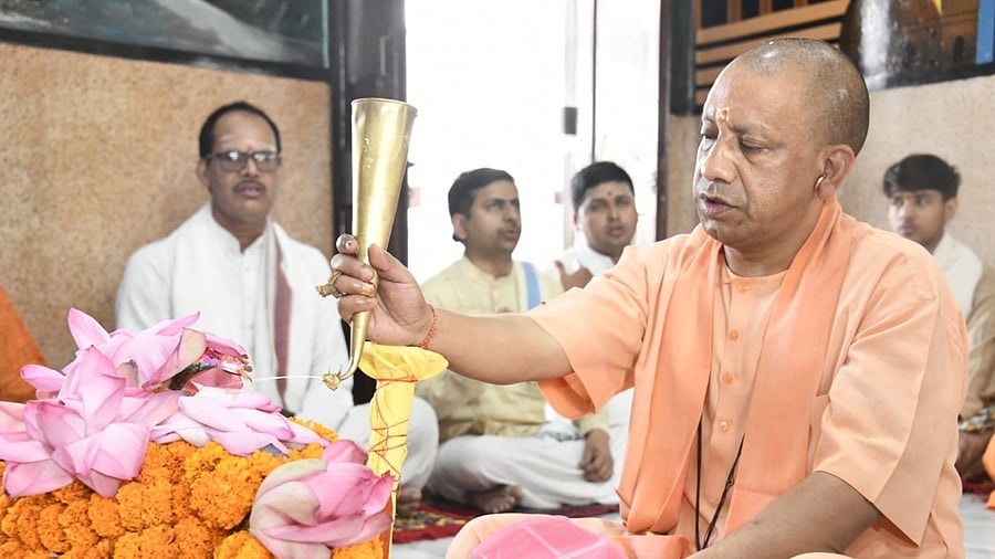 Yogi offering prayers on his birthday. Credit: IANS Photo
