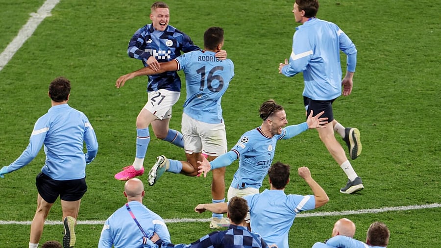 Manchester City players celebrate after winning the Champions League final. Credit: Reuters Photo