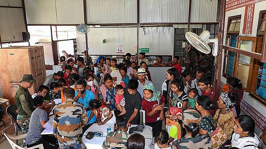 Locals at a medical camp organised by the Assam Rifles in Imphal for people of violence-hit areas in Manipur. Credit: PTI Photo