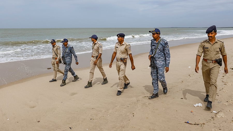 Gujarat and marine police personnel patrol the Mandvi beach ahead of the landfall of Biparjoy cyclone, in Mandvi of Kutch district. Credit: PTI Photo