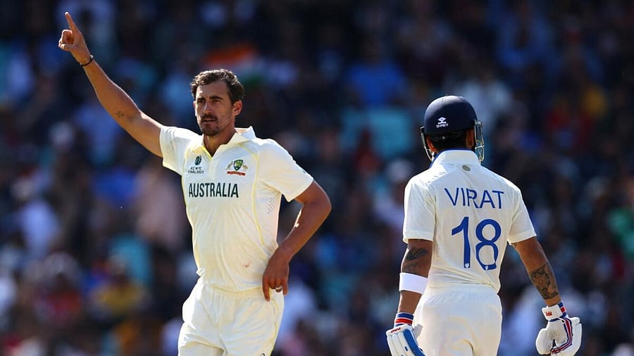 Mitchell Starc celebrates after taking the wicket of Virat Kohli. Credit: Reuters Photo