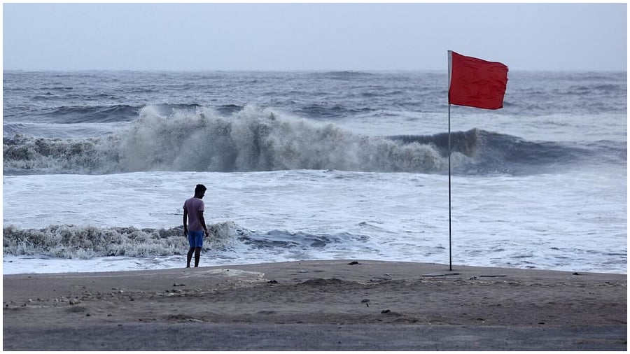 A lifeguard patrols Juhu beach, during a red flag alert due to rough seas caused by cyclone Biparjoy, in Mumbai, India, June 12, 2023. Credit: Reuters Photo