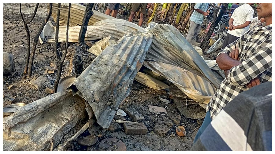 Locals at the site after a fire broke out in a house at Urdha village on Wednesday night, in Kushinagar district, Thursday, June 15, 2023. Credit: PTI Photo