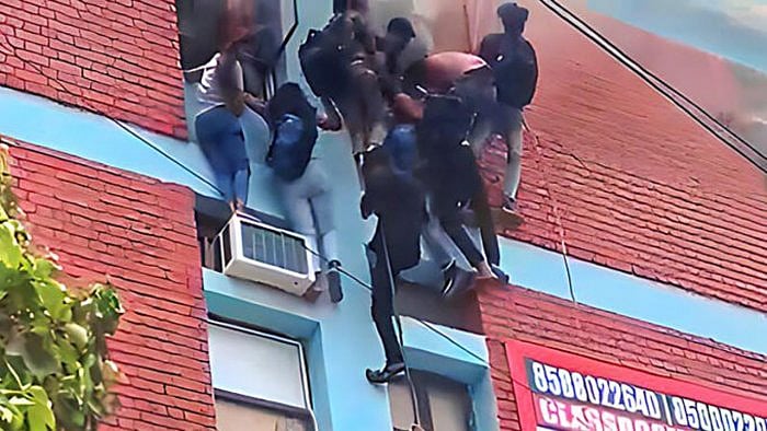 Students being rescued after a fire broke out at a coaching institute, at Mukherjee Nagar area in New Delhi, Thursday, June 15, 2023. Credit: PTI Photo