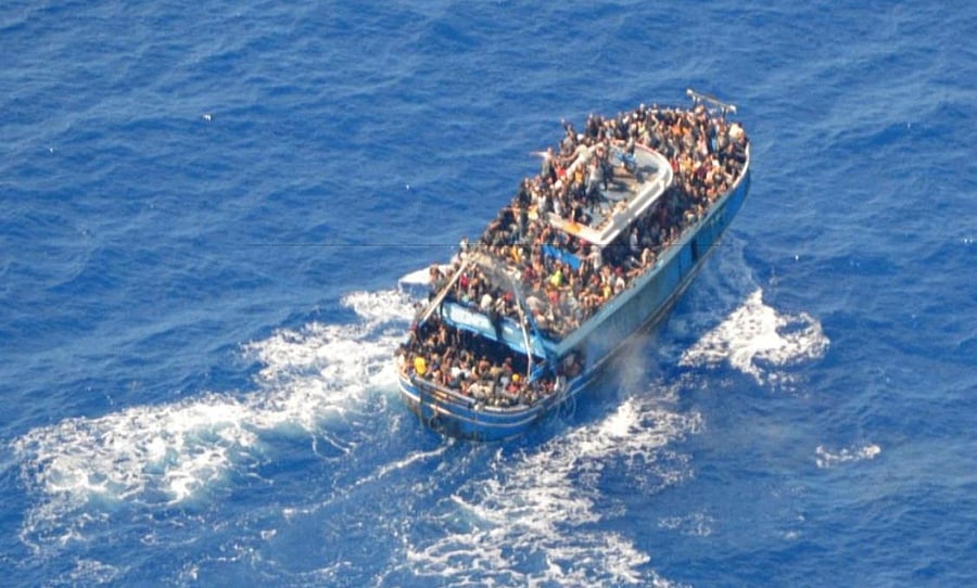 A undated handout photo provided by the Hellenic Coast Guard shows migrants onboard a boat during a rescue operation, before their boat capsized on the open sea, off Greece, June 14, 2023. Hellenic Coast Guard/Handout via Reuters