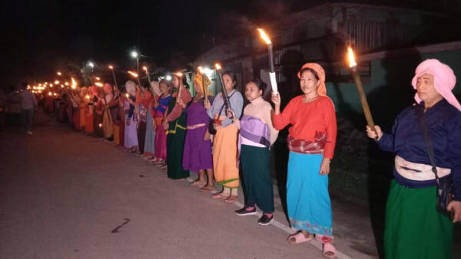 People in large numbers take part in a torchlight vigil in response to the ongoing violence in Manipur. Credit: PTI Photo