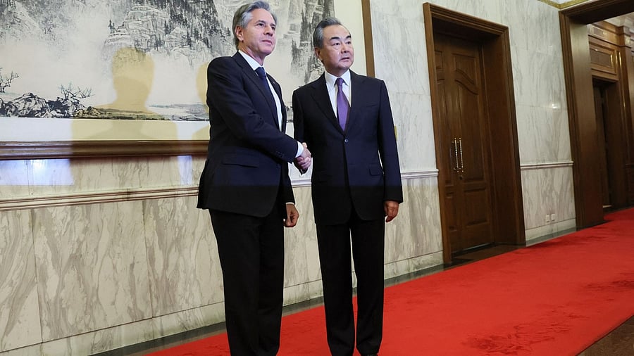 Antony Blinken shakes hands with China's Director of the Office of the Central Foreign Affairs Commission Wang Yi at the Diaoyutai State Guesthouse in Beijing. Credit: Reuters Photo